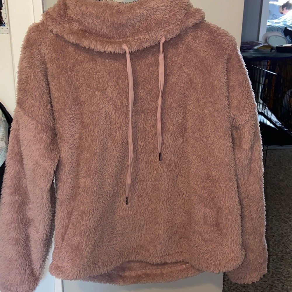 Very fluffy pink sweatshirt.